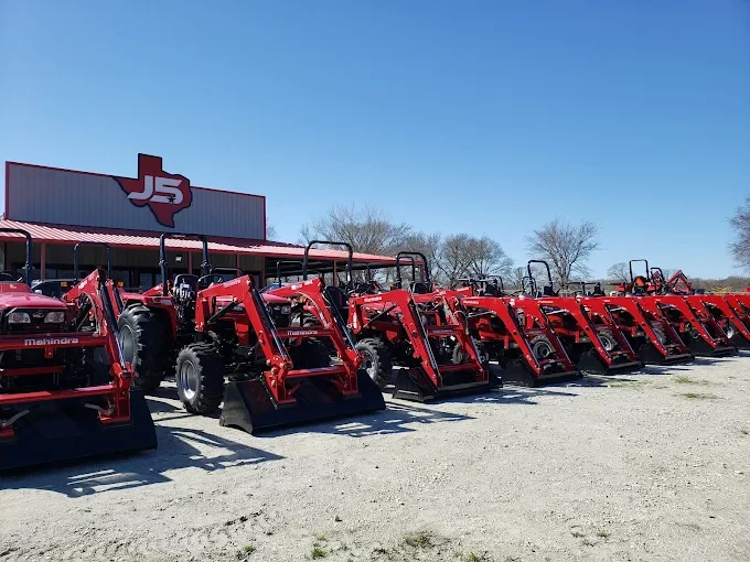 Mahindra tractors with front loaders parked outside the J5 Tractors store in Navasota, Texas